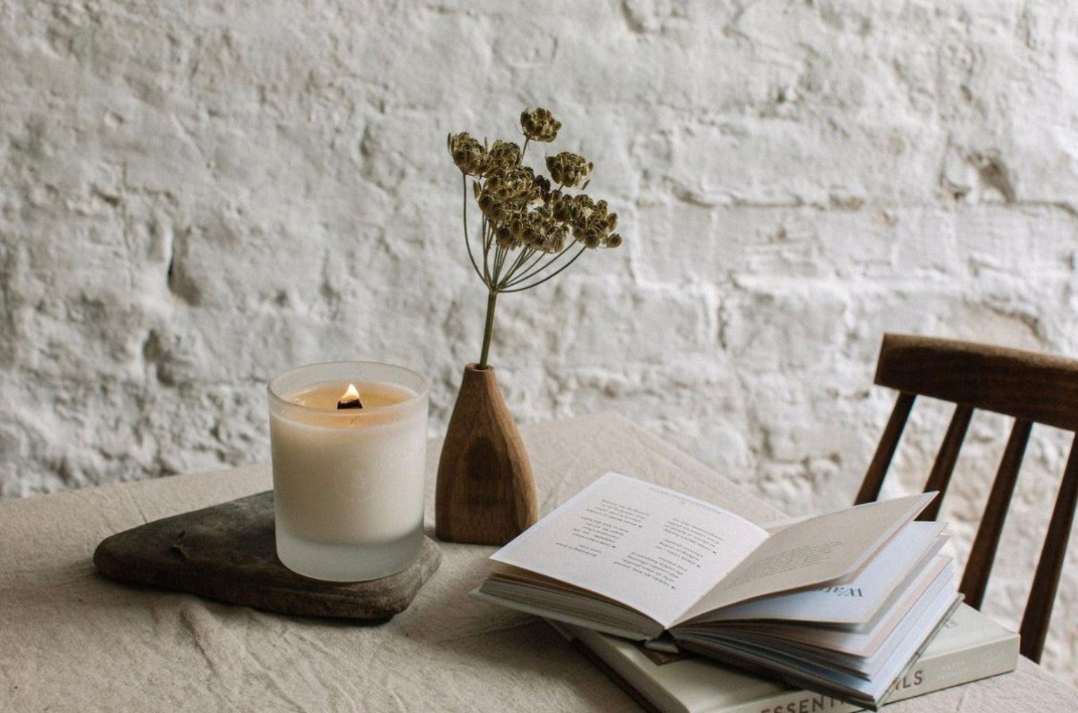 A candle, books and calm counselling room styling